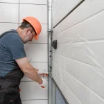 workerdoing+a+garage+door+repair+in+the+west+midlands