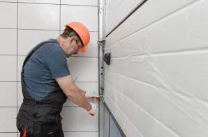 workerdoing+a+garage+door+repair+in+the+west+midlands