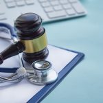 Gavel And Stethoscope. Medical Jurisprudence. Legal Definition Of Medical Malpractice. Attorney. Com