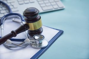 Gavel And Stethoscope. Medical Jurisprudence. Legal Definition Of Medical Malpractice. Attorney. Com